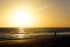 Watching the surfers at sunset.