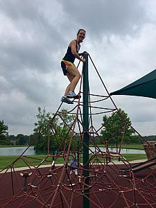 Kelly climbing at the playground